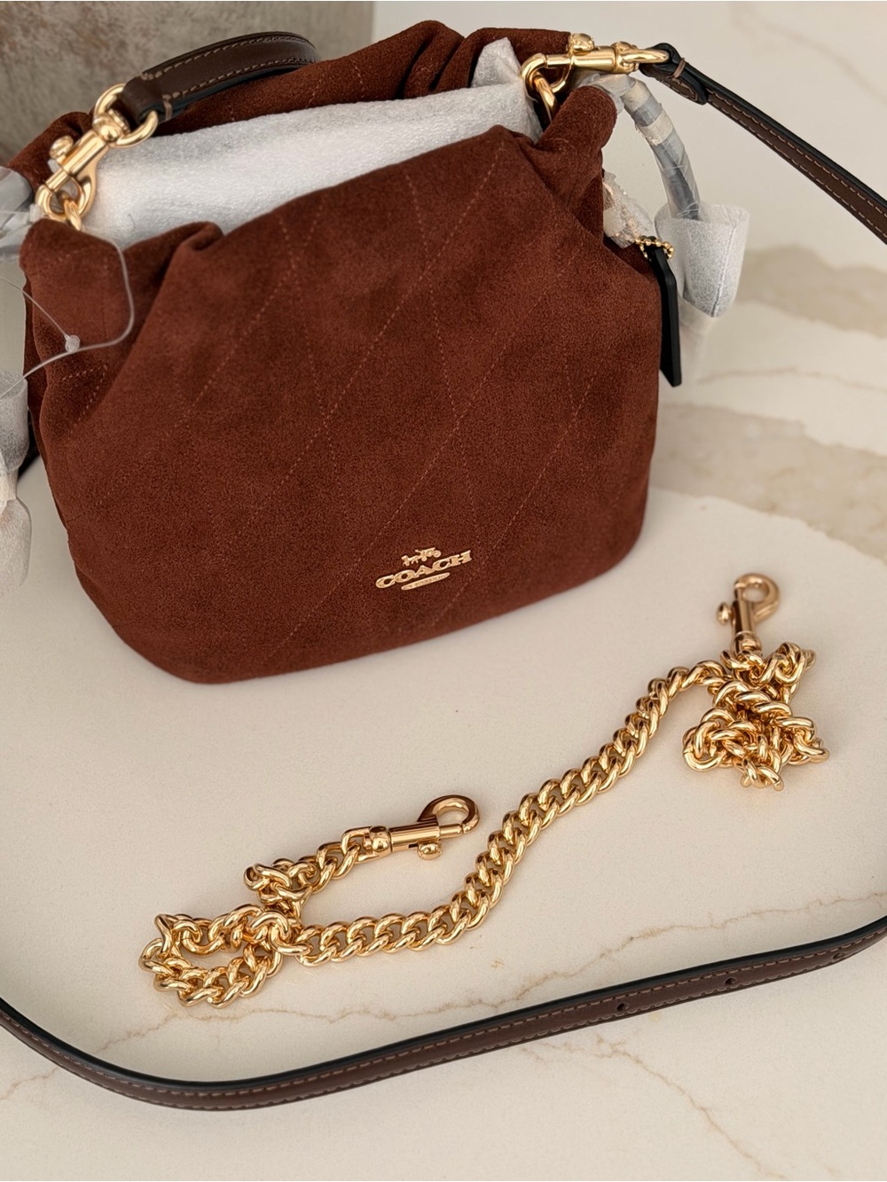 COACH Faye Mini Brown Suede Quilted Drawstring Bag